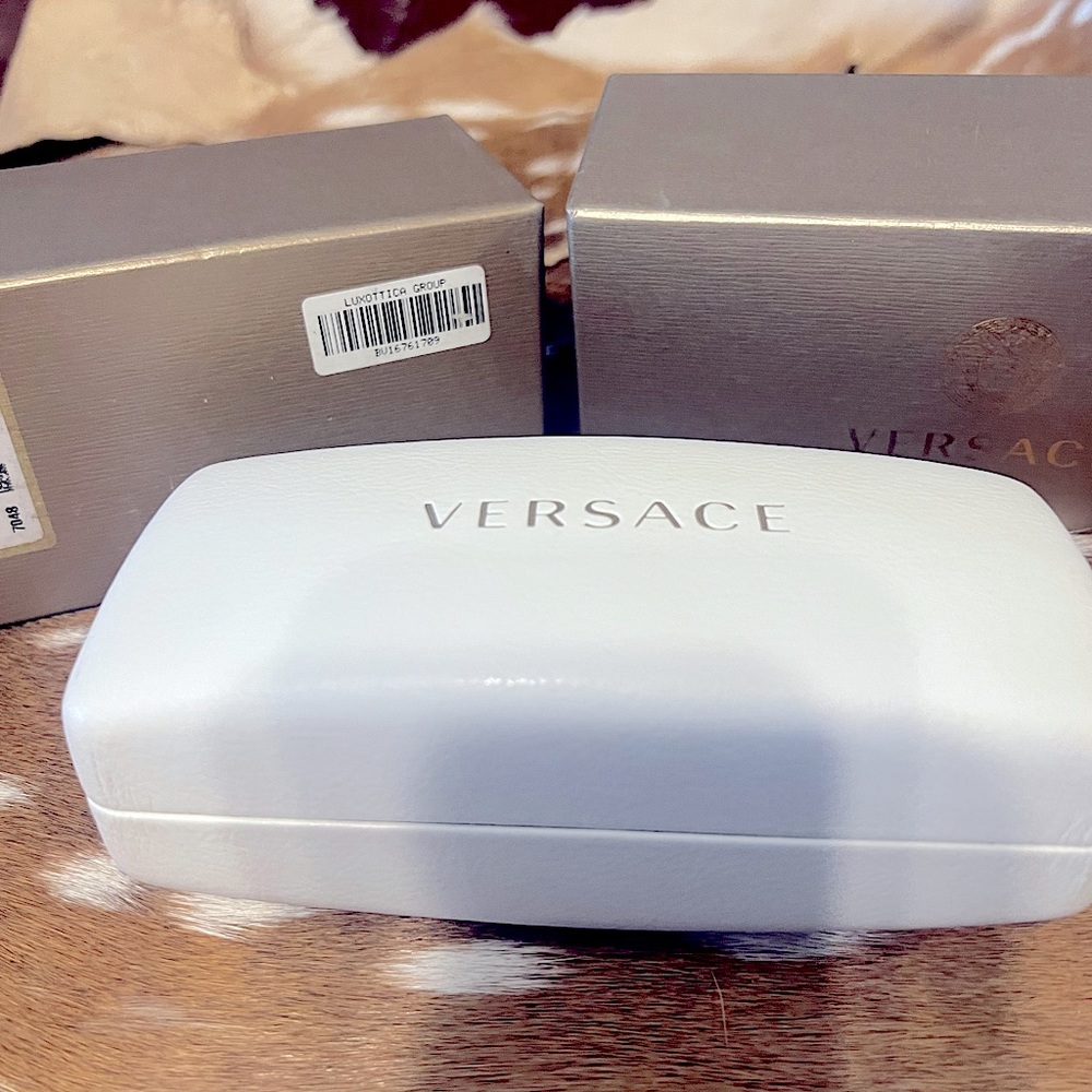 Luxottica/Versace sunglasses box, case, and lens cleaning cloth (unused).